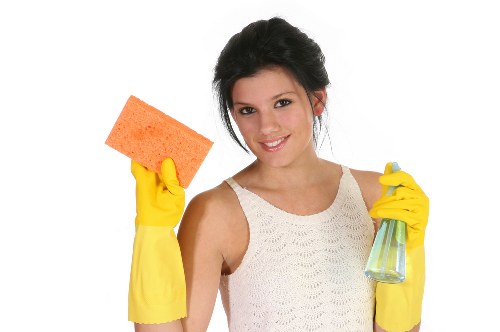 Cleaning staff sanitising a shared office area in NW6