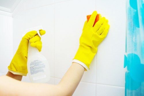 Cleaning technician applying safe chemical handling procedures