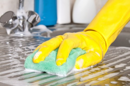 A cleaning team handling dust and debris during after builders cleaning in NW6